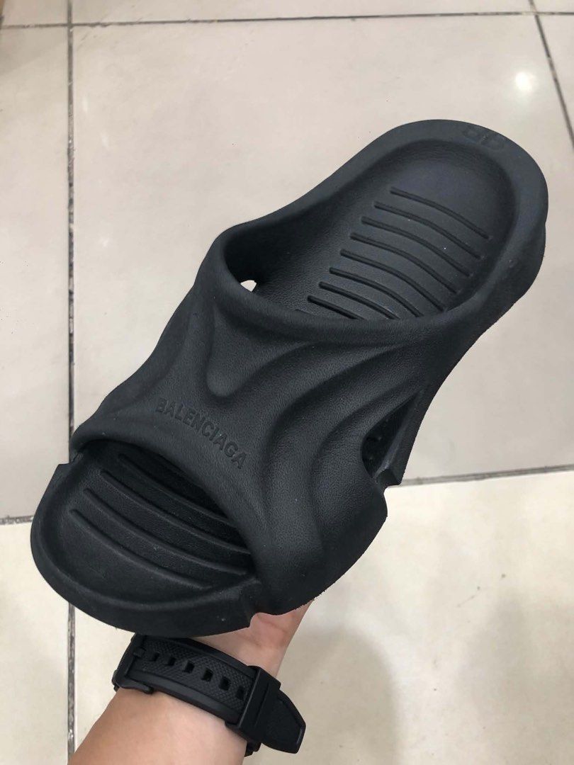 Balenciaga Cropped Runner Slides Black Size 38 (Category: Sneakers & Footwear) located in Bacolod City. Submitted by novymaesel14868 (Listing ID 1470999954, Image 3). Description: - Brand: Balenciaga - Item: Slide sandals - Color: Black - Size: 38 (marked on heel) - Material: Chunky molded foam with ribbed footbed - Details: Debossed logo on the strap - Condition: Clean, minimal wear on soles - Style: Easy slip-on for everyday streetwear.