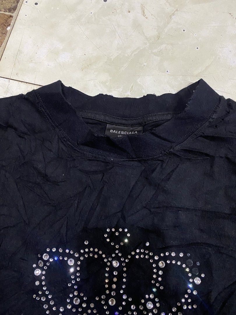 Balenciaga distress Rhinestone crown (Category: Tshirts & Polo Shirts ) located in Tagoloan. Submitted by puretiger-389e (Listing ID 1471048691, Image 2). Description: Balen. Distress buslotbulot 😅 Excellent condition Size xs on tag best fit Large 22x31 dimensions Issue nasa pic po missing po iba stone And washable po yang white Nanakal papo le.eg Dm..