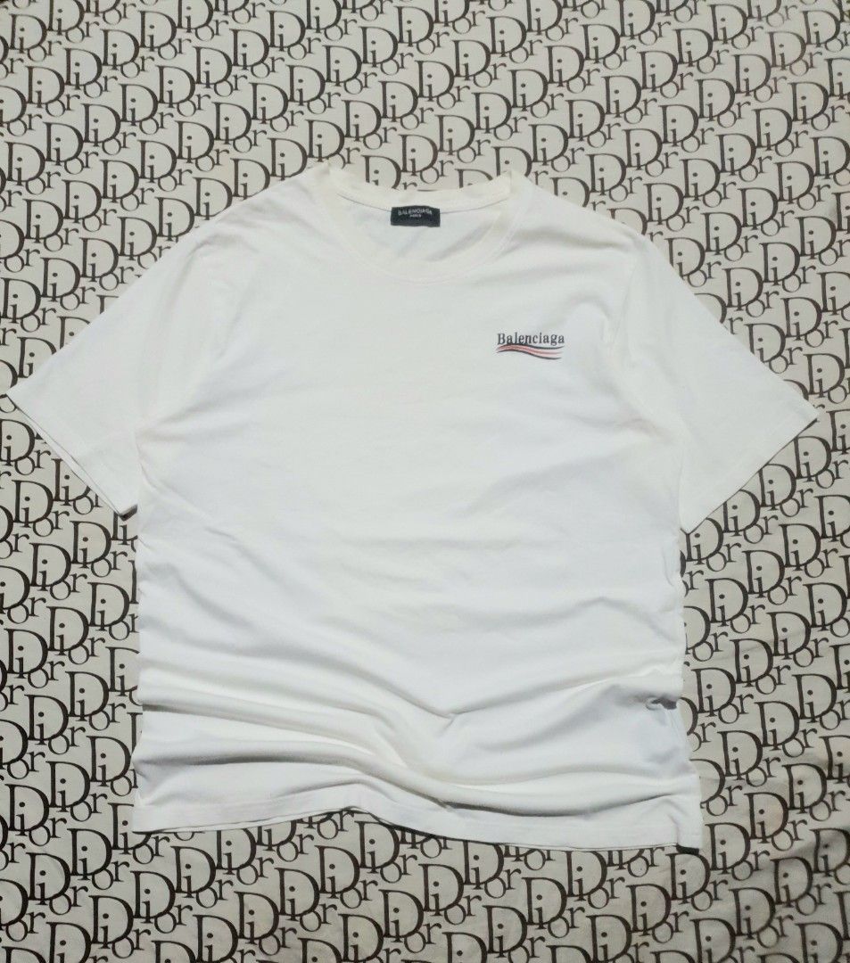 Balenciaga white campaign logo (Category: Tshirts & Polo Shirts ) located in San Fernando. Submitted by retro.district. (Listing ID 1471106661, Image 2). Description: - Balenciaga campaign logo - Size: Large(22x29) - Condition: Excellent - Issue: hairlines.
