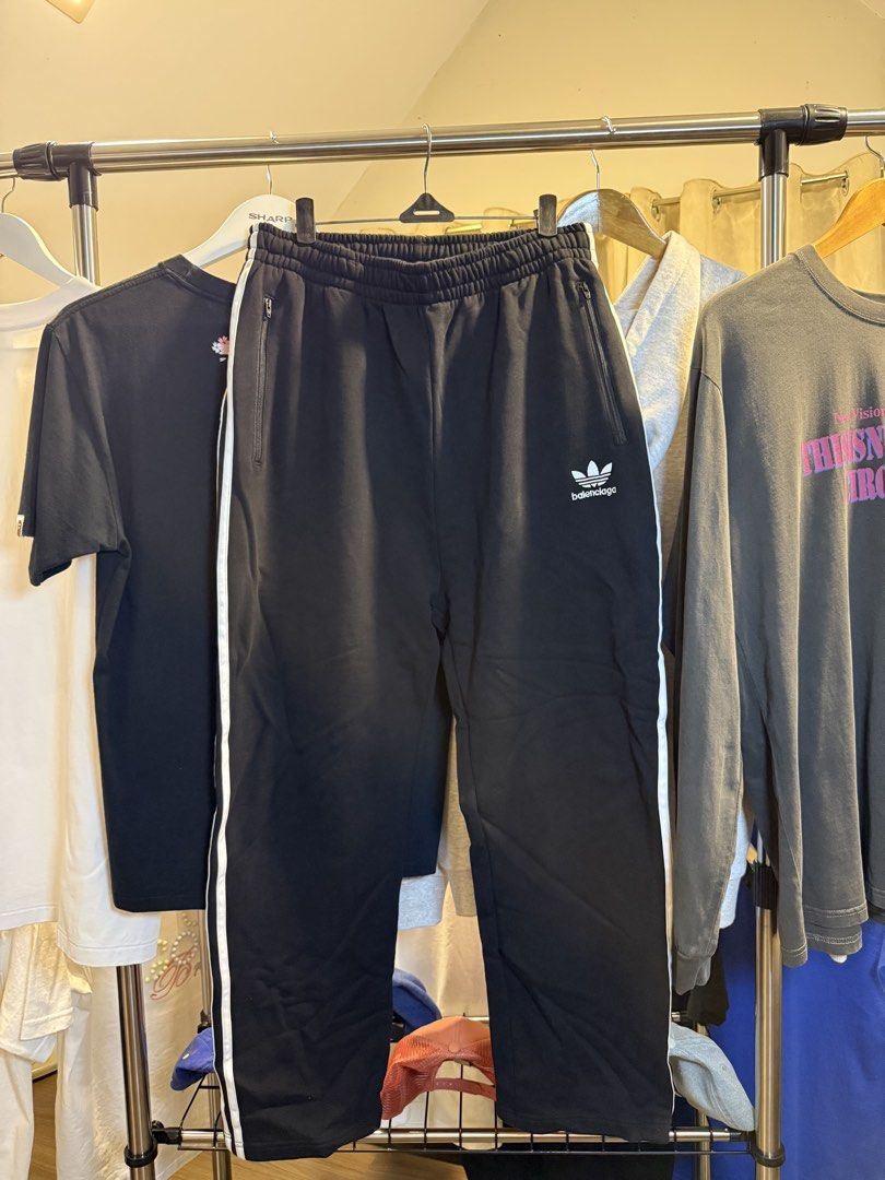 Balenciaga x Adidas Track Pants (Category: Joggers) located in Santa Rosa. Submitted by rgnrvn300 (Listing ID 1471047795, Image 1). Description: - Brand: Balenciaga x Adidas collaboration - Color: Black with classic white stripes - Size: L - Features: Convenient side zip pockets and front embroidered branding - Origin: Made in Italy - Condition: Excellent, 100% authentic.