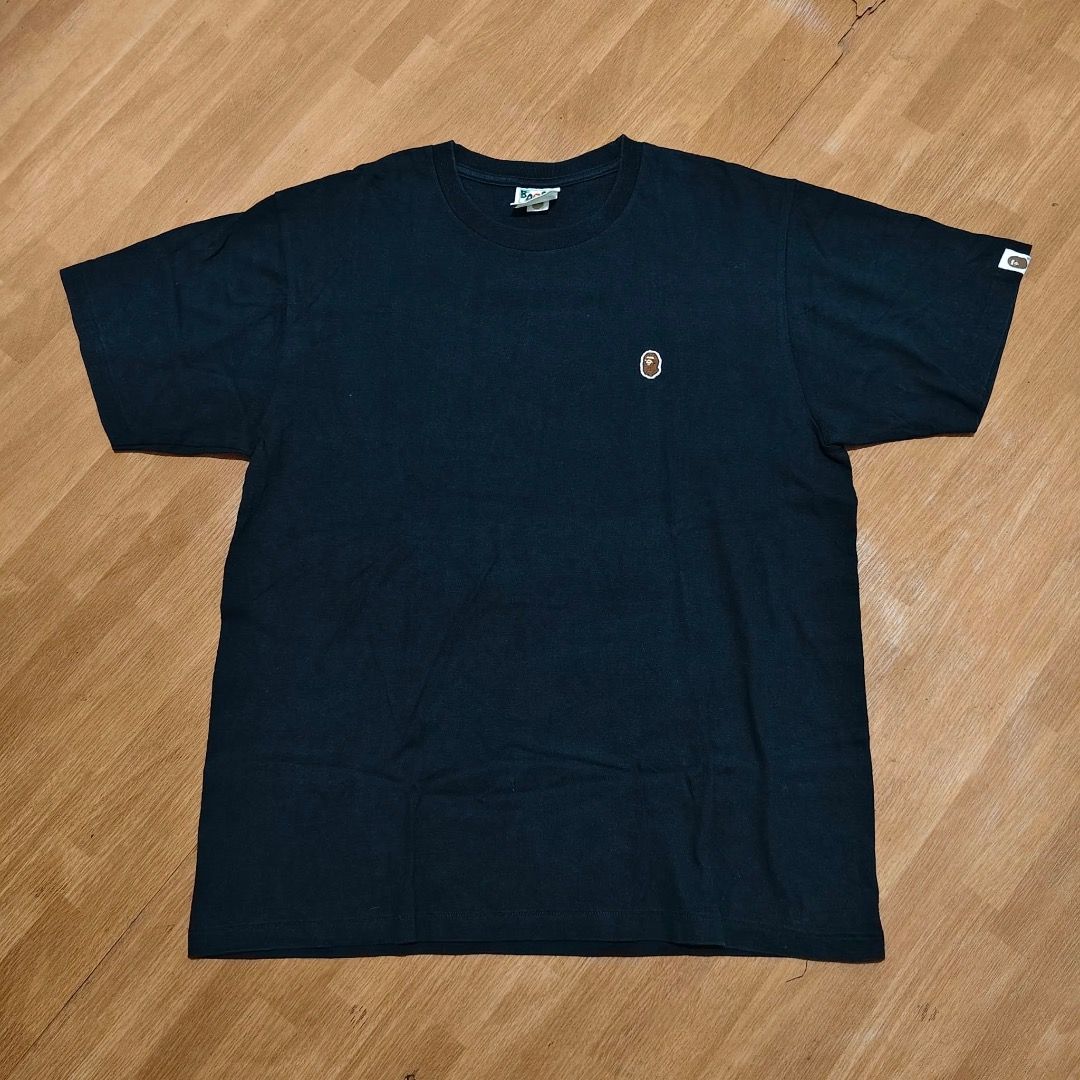 BAPE ONE POINT SHIRT FOR SALE (Category: Tshirts & Polo Shirts ) located in Caloocan City. Submitted by klozet.ph2026 (Listing ID 1471046029, Image 1). Description: - Brand: A Bathing Ape (Bape) - Color: Solid Black - Size: Large (Regular fit) - Design: Small embroidered ape head logo on the chest - Details: Classic Bape neck tag and sleeve tag attached - Material: 100% Cotton - Condition: Clean and well-maintained - Style: Perfect for everyday s