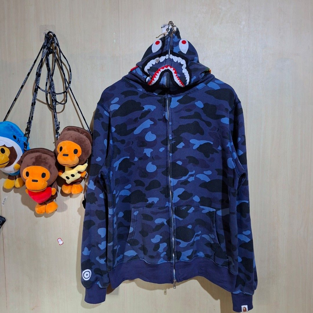 BAPE Shark Blue Camou By A Bathing Ape (Category: Hoodies) located in Bayambang. Submitted by thedonedeal (Listing ID 1470943025, Image 1). Description: BAPE SHARK A Bathing Ape Dimes: w23 ×L27 Check Every Pic for Details NO RUSH ORDER!!.