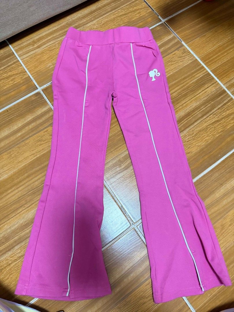 Barbie Pink Flare Pants Size 6 (Category: Babies & Kids Fashion) located in Manila. Submitted by enticexx (Listing ID 1471051105, Image 1). Description: - Color: Bright pink with white piping - Style: Flared cut with iconic Barbie silhouette logo near the hip - Size 6 .