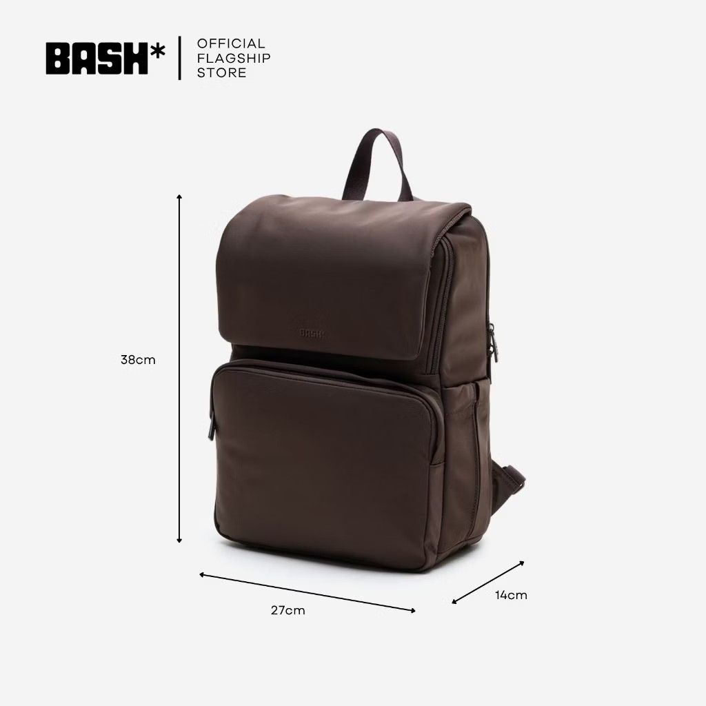 BASH* Brown Everyday Backpack with Laptop Compartment (Category: Backpacks) located in Pasig City. Submitted by janelchoo (Listing ID 1471025720, Image 2). Description: - Brand: BASH* - Color: Solid dark brown - Dimensions: 38cm x 27cm x 14cm - Padded laptop compartment inside and spacious main section - Trolley sleeve on the back that doubles as a zip pocket - Smooth zippers and sturdy top handle - Ideal for daily commutes, school, or travel.