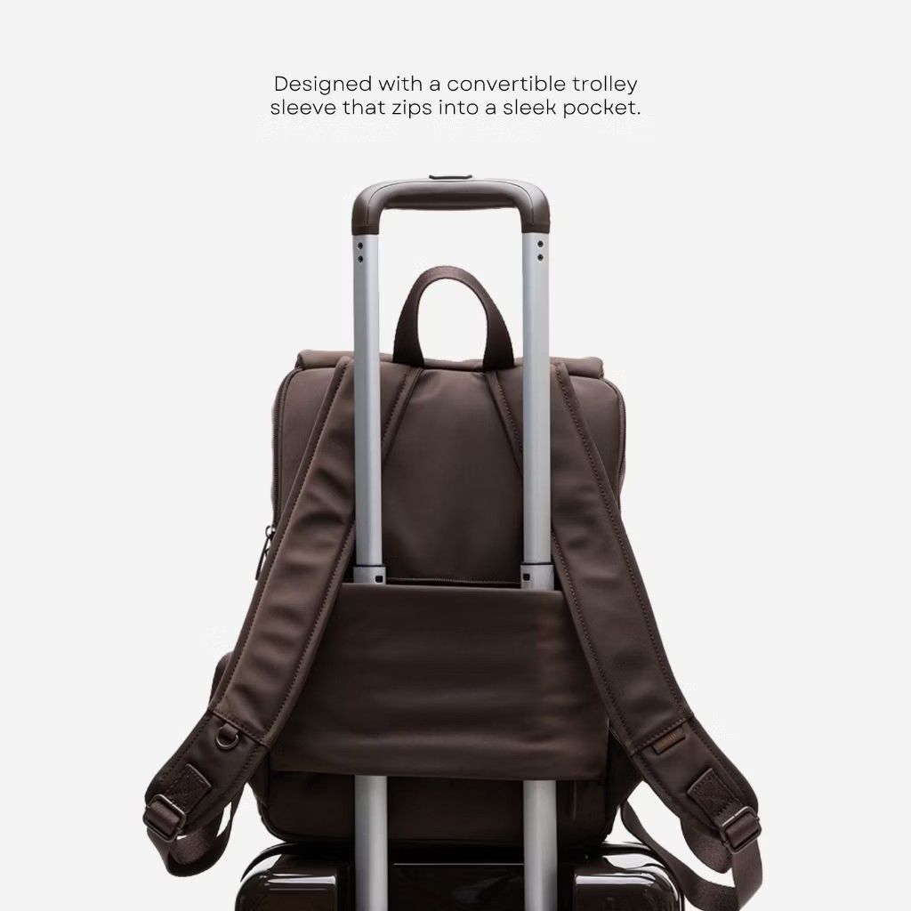 BASH* Brown Everyday Backpack with Laptop Compartment (Category: Backpacks) located in Pasig City. Submitted by janelchoo (Listing ID 1471025720, Image 3). Description: - Brand: BASH* - Color: Solid dark brown - Dimensions: 38cm x 27cm x 14cm - Padded laptop compartment inside and spacious main section - Trolley sleeve on the back that doubles as a zip pocket - Smooth zippers and sturdy top handle - Ideal for daily commutes, school, or travel.