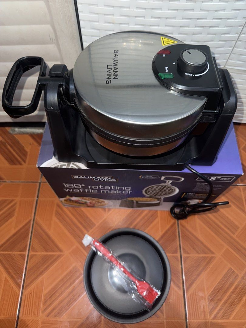 Baumann Living 180 Rotating Waffle Maker (Category: Cookware & Accessories) located in Manila. Submitted by mixi_lexi (Listing ID 1471045027, Image 2). Description: - Brand: Baumann Living 180-Degree Rotating Waffle Maker - Capacity: Makes delicious 8-inch Belgian-style waffles - Design: Sleek stainless steel finish with black accents and smooth-rotating handle for even batter distribution - Controls: Adjustable browning control dial with power a