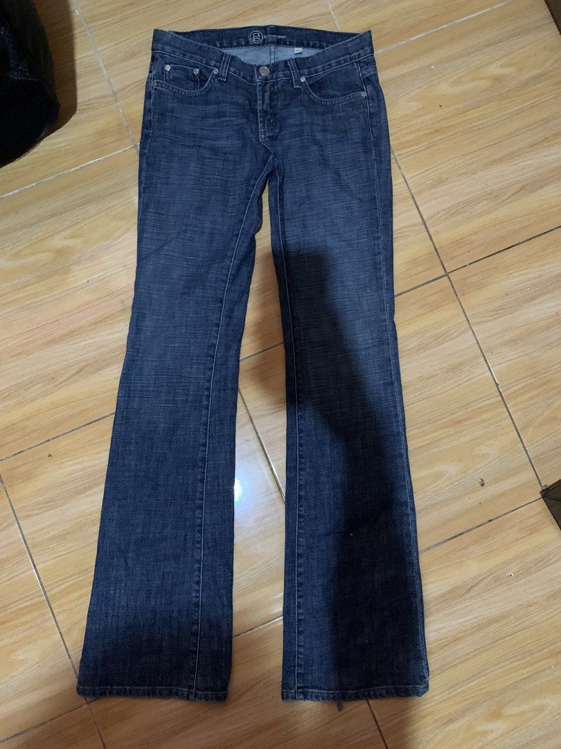 bebe Dark Wash Flare Jeans Size 27 (Category: Jeans) located in Davao. Submitted by sadthrift (Listing ID 1470964788, Image 1). Description: - Brand: bebe - Style: Dark wash denim flare jeans with low-rise fit - Size: 27 - Material: 98% cotton, 2% spandex (slight stretch) - Origin: Made in USA - Details: Rhinestone embellishments on back pockets, standard five-pocket styling, branded buttons and pocket lining - Condition: Excellent pre-loved cond