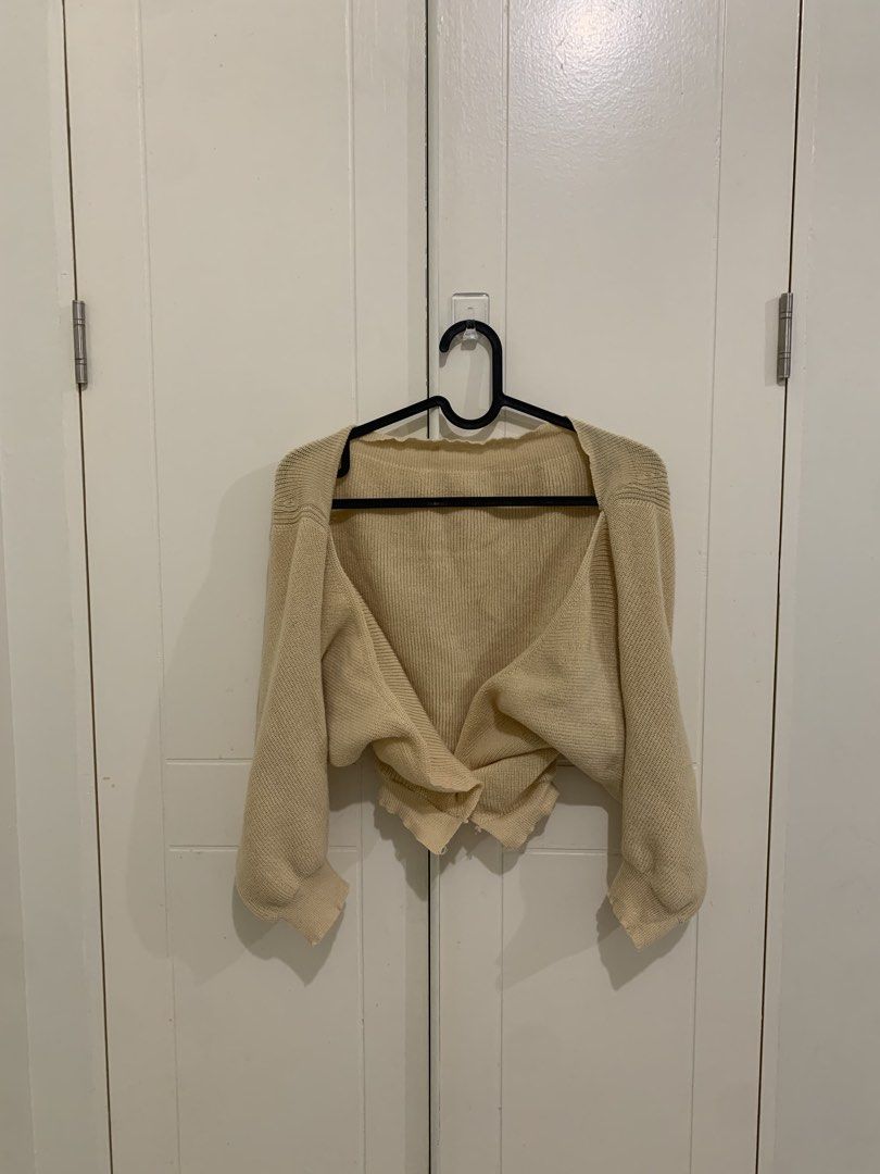 Beige Knit Cropped Cardigan Sweater (Category: Coats, Jackets and Outerwear) located in Pasig City. Submitted by lovedbyri (Listing ID 1471003953, Image 1). Description: - Color: Beige - Style: Cropped cardigan with V-neckline and long sleeves - Fabric: Soft, lightweight ribbed knit - Condition: Worn a few times, very good shape - Best for: Versatile layering over tanks, tees, and dresses.