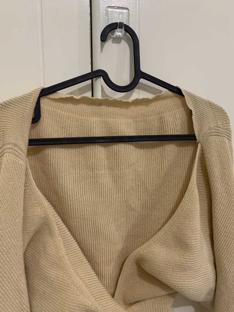 Beige Knit Cropped Cardigan Sweater (Category: Coats, Jackets and Outerwear) located in Pasig City. Submitted by lovedbyri (Listing ID 1471003953, Image 2). Description: - Color: Beige - Style: Cropped cardigan with V-neckline and long sleeves - Fabric: Soft, lightweight ribbed knit - Condition: Worn a few times, very good shape - Best for: Versatile layering over tanks, tees, and dresses.