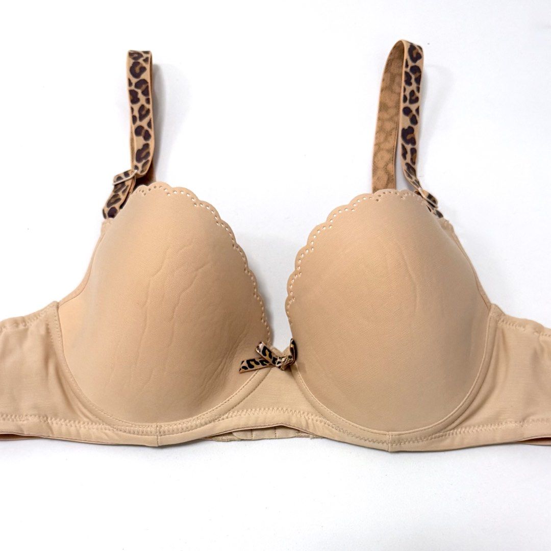 Beige Seamless Underwired Bra w/ Leopard Straps [36B] (Category: Undergarments & Loungewear) located in Malabon City. Submitted by k_intimates (Listing ID 1471097682, Image 2). Description: Details: • Size 36B / wired / lightly lined • Min. sign of use on the cups (check photos) • Beige underwired bra featuring scalloped edges and leopard patterned straps..