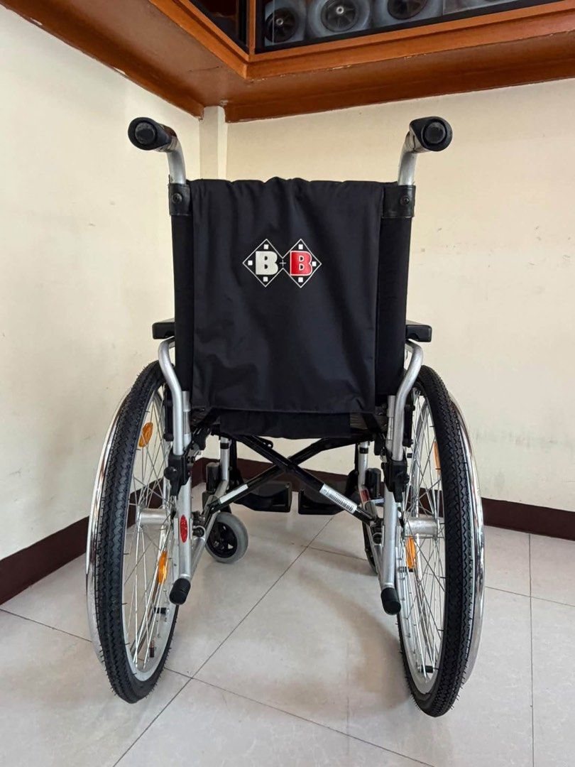 Bischoff & Bischoff Pyro Start Plus Wheelchair (Category: Wheelchairs) located in Manila. Submitted by calmdolphin.87b0e4 (Listing ID 1470954317, Image 3). Description: - Model: Bischoff & Bischoff Pyro Start Plus - Color: Black and silver - Frame: Lightweight metal, fully foldable for easy transport and storage - Seating: Comfortable padded backrest and seat with clean fabric upholstery (minimal signs of wear) - Mobility & Safety: Sturdy wheels 