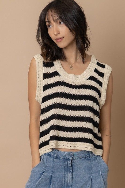Black and Beige Striped Knit Vest (Category: Sleeveless) located in Bacoor. Submitted by Miss_Chuch0521 (Listing ID 1470964109, Image 2). Description: - Color: Black and beige stripes - Design: Open knit pattern with ribbed collar and armholes - Fit: Sleeveless, relaxed boxy fit - Styling: Great layering piece or wearable on its own.