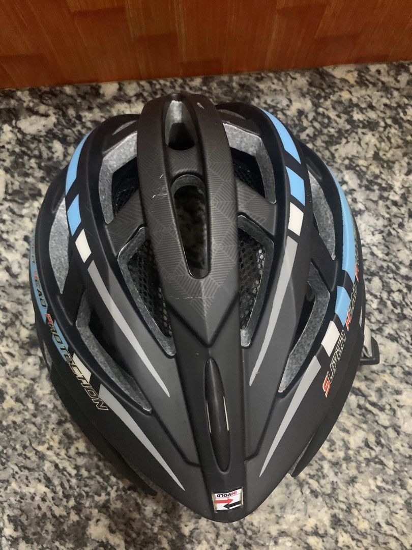 Black and blue cycling helmet with adjustable straps (Category: Bicycles) located in Malabon City. Submitted by ena.gregorio (Listing ID 1471008615, Image 2). Description: - Color: Black, grey, and light blue - Design: Aerodynamic with multiple ventilation slots to keep you cool - Comfort & Fit: Adjustable light grey straps and internal mesh lining for a secure fit - Build: Durable in-mold construction - Usage: Ideal for bike commutes and weekend