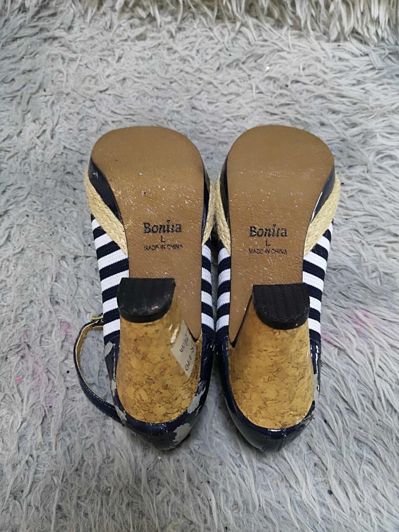 Black and White Striped Espadrille Platform Pumps (Category: Heels) located in Santa Cruz. Submitted by jmy_surplus.2 (Listing ID 1470937604, Image 3). Description: Size ; 24cm Color: Black, white, and natural beige Type/Kind: Women's closed-toe pumps with ankle straps, platform soles, and chunky heels Material: Upper: Striped textile fabric, possibly cotton or polyester Heel counter and trim: Glossy black synthetic leather Platform edging: Natur