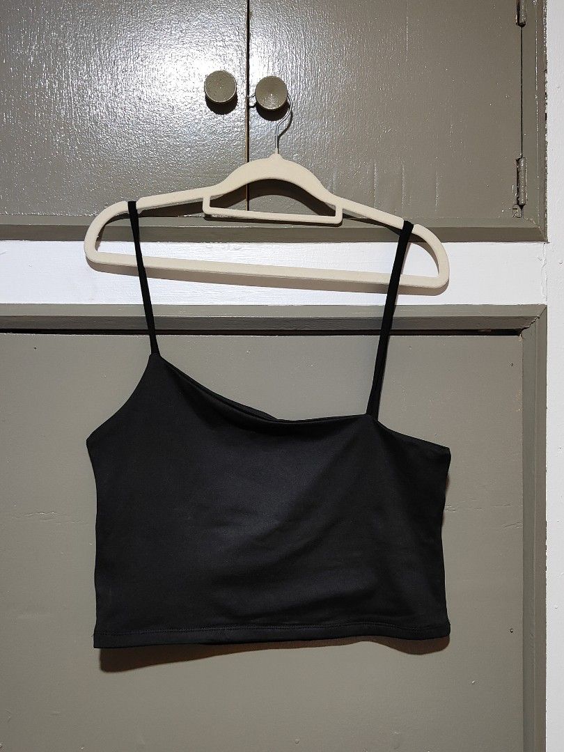 Black Asymmetric Crop Top Spaghetti Strap (Category: Sleeveless) located in Quezon City. Submitted by thestargazerspica (Listing ID 1471045497, Image 1). Description: - Color: Black - Style: One-shoulder asymmetric neckline with thin spaghetti straps - Fit: Stretchy fabric, snug and flattering fit - Versatility: Easy to pair with high-waisted jeans, skirts, or shorts - Condition: Brand new / Excellent quality.