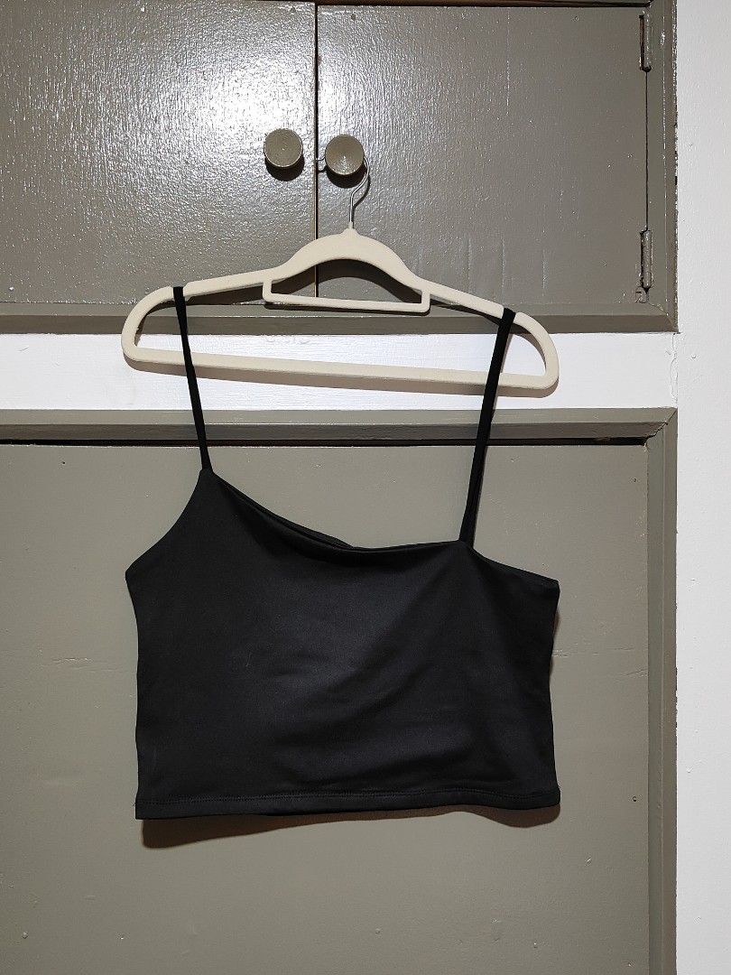 Black Asymmetric Crop Top Spaghetti Strap (Category: Sleeveless) located in Quezon City. Submitted by thestargazerspica (Listing ID 1471045497, Image 3). Description: - Color: Black - Style: One-shoulder asymmetric neckline with thin spaghetti straps - Fit: Stretchy fabric, snug and flattering fit - Versatility: Easy to pair with high-waisted jeans, skirts, or shorts - Condition: Brand new / Excellent quality.