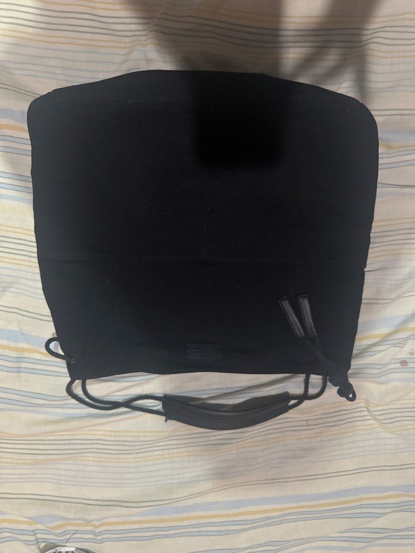 Black Canvas Shoulder Bag with Leather Handles (Category: Shoulder Bags) located in Talisay. Submitted by kuyav (Listing ID 1471037438, Image 1). Description: - Color: Solid black - Material: Durable canvas with reinforced leather handle - Closure: Side drawstring - Storage: Convenient front patch pocket - Style: Versatile everyday design, clean fabric finish.