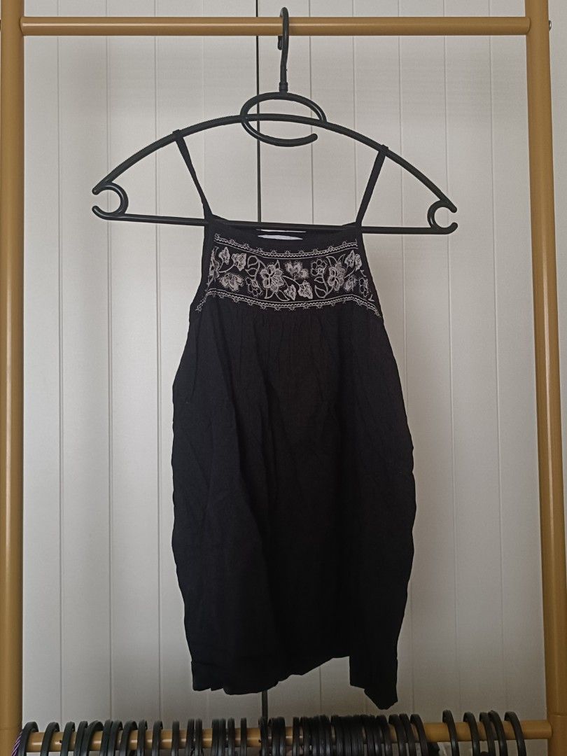 Black Floral Embroidered Tank Top Cami (Category: Sleeveless) located in Bacoor. Submitted by Miss_Chuch0521 (Listing ID 1470962803, Image 1). Description: - Color: Classic Black - Design: Delicate white floral embroidery on the front neckline - Fit: Flowy, gathered fabric style with thin spaghetti straps - Material: Lightweight, breathable fabric ideal for PH weather - Versatility: Great for casual days out, beach trips, or easy layering - Condi