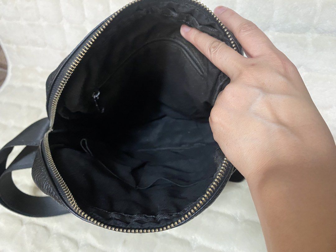 Black Leather Crossbody Bag with Multiple Pockets (Category: Sling Bags) located in Baguio. Submitted by SweetRepeat (Listing ID 1470936753, Image 3). Description: - Material: genuine leather - Strap: Adjustable webbing strap - Hardware: Sturdy silver-tone zippers - Pockets: Front zipped pocket, extra slip pocket, and inner side pockets - Compartment: Spacious main compartment - Usage: Ideal size for daily essentials like phone, keys, and wallet.