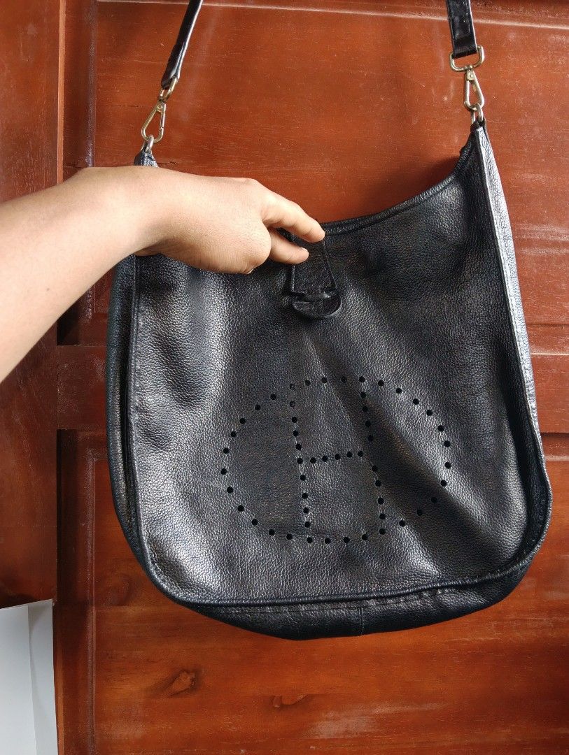Black Leather Hobo Bag (Category: Tote Bags) located in Cagayan de Oro. Submitted by warmbird-f84aab (Listing ID 1470993772, Image 1). Description: 🖤 Material: Genuine pebbled leather — soft, durable & high-quality ✨ Features: Perforated CH logo design, suede-like interior, 1 inner zip pocket, adjustable & detachable strap, YKK branded hardware 📏 Size: Spacious — fits daily essentials + more 💡 Condition: Pre-loved, well-cared for, no major fla