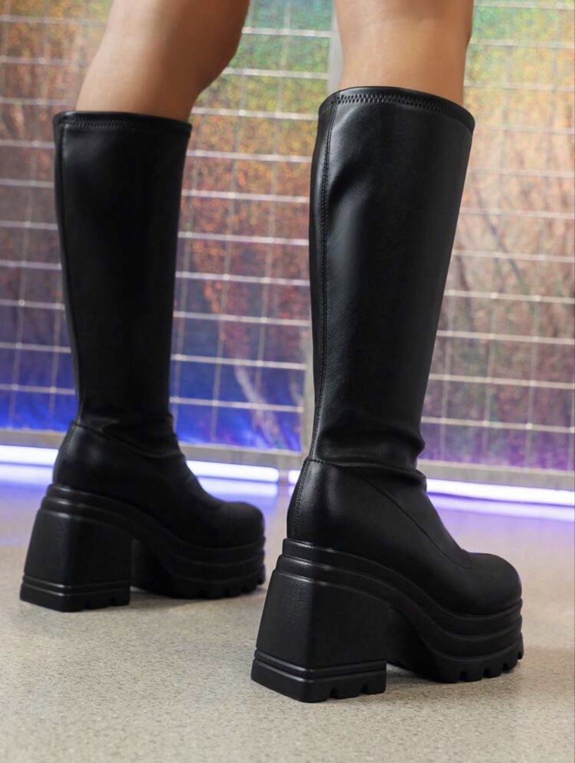 Black Platform Chunky Heel Mid-Calf Boots (Category: Boots) located in Manila. Submitted by coffeeislyf (Listing ID 1470984983, Image 2). Description: - Size: EUR 42 - Color: Sleek black mid-calf boots - Material: Stretchy elastic faux leather for a snug, comfortable fit - Heel & Platform: 4.1-inch chunky heel with a 2-inch platform - Measurements: 13-inch shaft height and 13.4-inch leg circumference - Design: Easy pull-on style with no zippers -