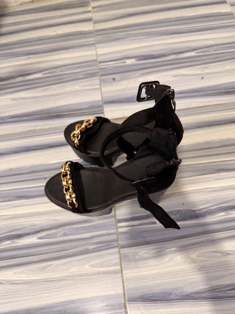 Black Platform Heels with Gold Chain Detail (Category: Heels) located in Baguio. Submitted by nabiwuh.06 (Listing ID 1471019775, Image 2). Description: - Black platform sandals with chunky heel and thick front detail - Elegant gold chain links on the front strap - Material: Soft suede-like finish - Closure: Adjustable ankle buckle and convenient back zipper - Condition: Brand new / Excellent - Mode of Payment: GCash, BPI, or COD via shipping - 5 