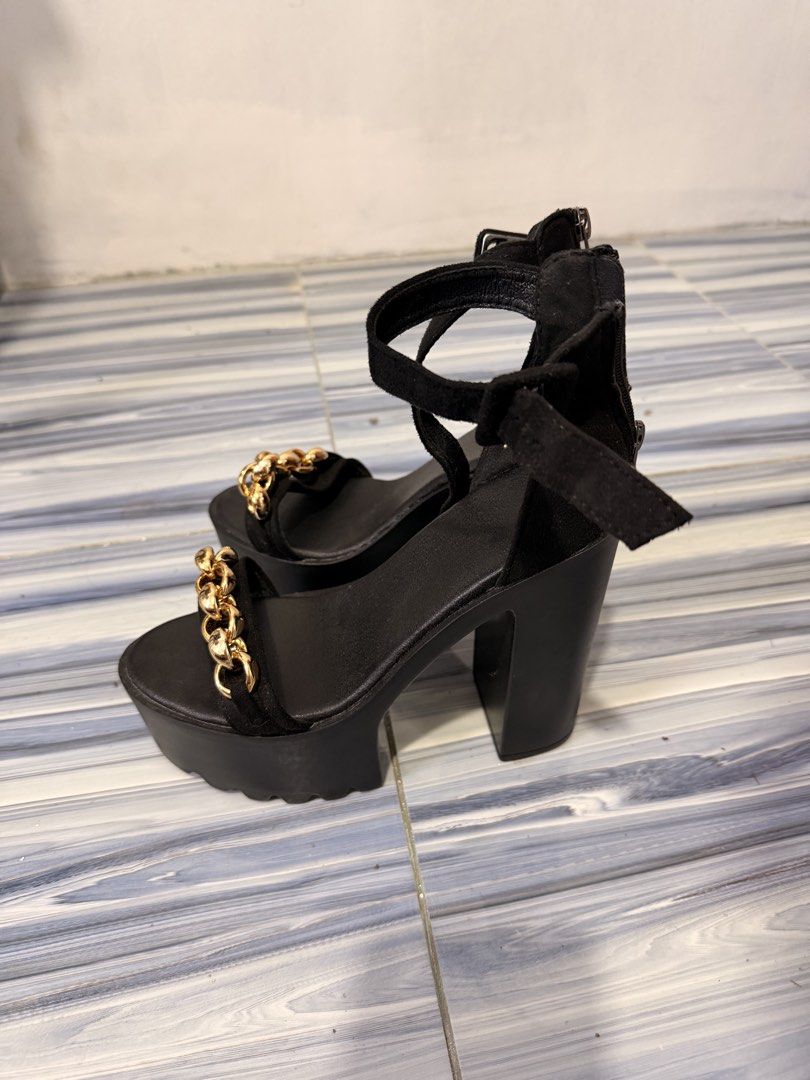Black Platform Heels with Gold Chain Detail (Category: Heels) located in Baguio. Submitted by nabiwuh.06 (Listing ID 1471019775, Image 1). Description: - Black platform sandals with chunky heel and thick front detail - Elegant gold chain links on the front strap - Material: Soft suede-like finish - Closure: Adjustable ankle buckle and convenient back zipper - Condition: Brand new / Excellent - Mode of Payment: GCash, BPI, or COD via shipping - 5 
