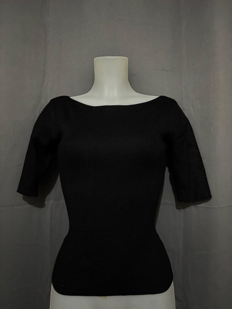 Black ribbed boat neck knit top (Category: Sleeveless) located in Pasig City. Submitted by jangrepuya23 (Listing ID 1471096683, Image 1). Description: Black ribbed knit top with a boat neckline and half sleeves. Fitted silhouette. Stretchy fabric. Great basic piece for layering or wearing on its own..