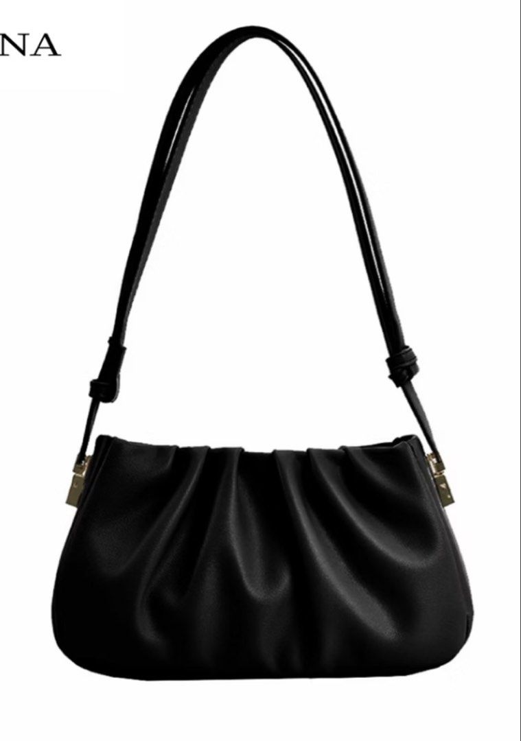 Black Ruched Shoulder Bag (Category: Shoulder Bags) located in Manila. Submitted by coffeeislyf (Listing ID 1470985835, Image 1). Description: - Color: Classic Black - Material: Textured faux leather - Design: Trendy gathered, ruched style with metallic hardware accents - Strap: Comfortable shoulder strap included - Condition: Clean interior and exterior, with minor creases from storage only.