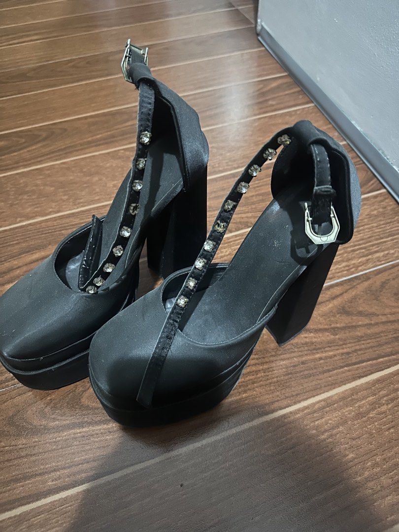 Black Satin Rhinestone T-Strap Platform Heels (Category: Heels) located in Manila. Submitted by ccamilg (Listing ID 1470978041, Image 1). Description: - Style: Black satin platform heels with super chunky block heels - Design: Sparkly rhinestone embellishments along the T-strap - Comfort: Thick platform sole for added stability - Closure: Adjustable buckle at the ankle strap - Perfect for: Parties, nights out, clubbing, and statement looks - Cond