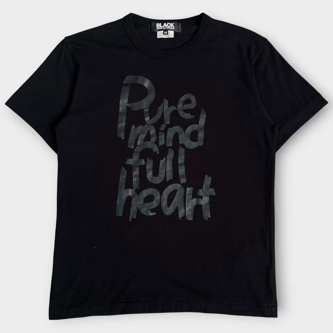 BLACK S/S25 - Comme des Garcons - Pure Mind Full Heart Statement Tee (Category: Tshirts & Polo Shirts ) located in Los Banos. Submitted by declutterking (Listing ID 1471087815, Image 1). Description: Size Medium on tag • modern release • asian sizing Dimensions: 16" shoulders 18" chest 26.25" length 7" sleeves Good as new condition Authentic.