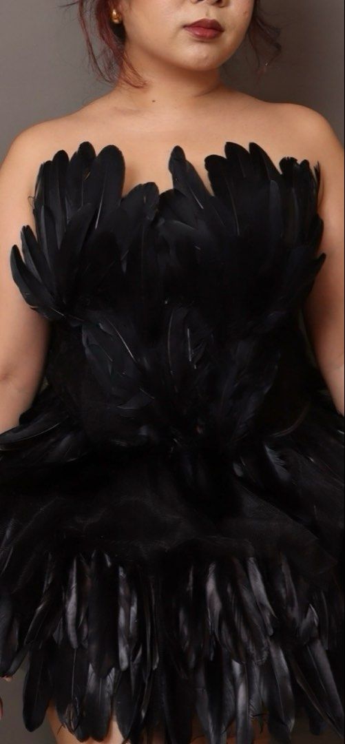 Black Swan Halloween Costume (Category: Dresses) located in Tanay. Submitted by midnight.jiji (Listing ID 1471072685, Image 2). Description: - Color: Black - Style: terno, structured fit, mini length - Material: Covered in feathers - Occasion: Perfect for Halloween, parties, or stage performances - Size: Top fits L-XL, Skirt fits free size up to 100cm.