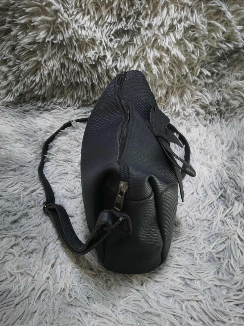 Black Textured Bow Detail Shoulder Bag (Category: Cross-body Bags) located in Santa Cruz. Submitted by jmy_surplus.2 (Listing ID 1471021495, Image 2). Description: Color: Black Type/Kind: Shoulder Bag / Crossbody Bag / Bow Bag Material: Body: Textured Faux Leather / Synthetic Leather (unverified) Strap: Textured Synthetic Material Lining: Black Fabric Hardware: Silver-Tone Metal Style: Feminine Girly Coquette Cute Casual Chic Minimalist Korean-In