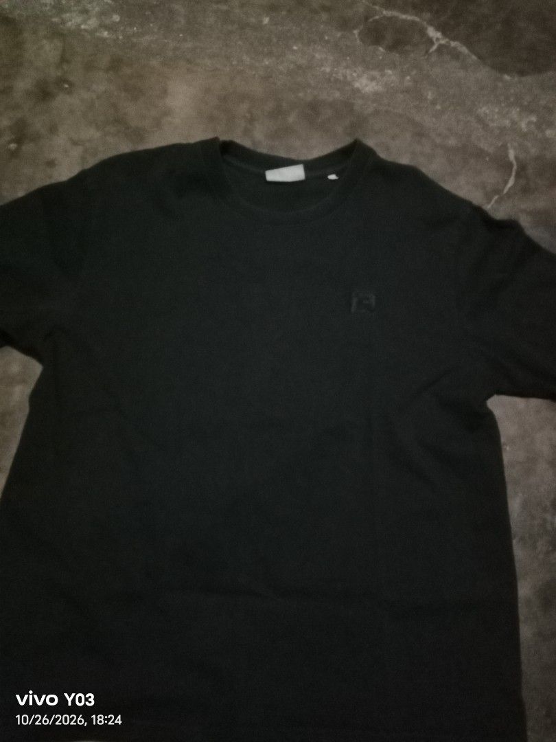 Black T-Shirt with Chest Logo (Category: Tshirts & Polo Shirts ) located in Cabuyao City. Submitted by blake657 (Listing ID 1471055037, Image 1). Description: - Color: Classic Black - Fit: Relaxed fit with short sleeves and crew neck - Details: Chic small square patch logo embroidered on the left chest - Material: Ultra-soft, breathable cotton fabric - Styling: Perfect for pairing with jeans or shorts for everyday casual looks - Condition: Brand 