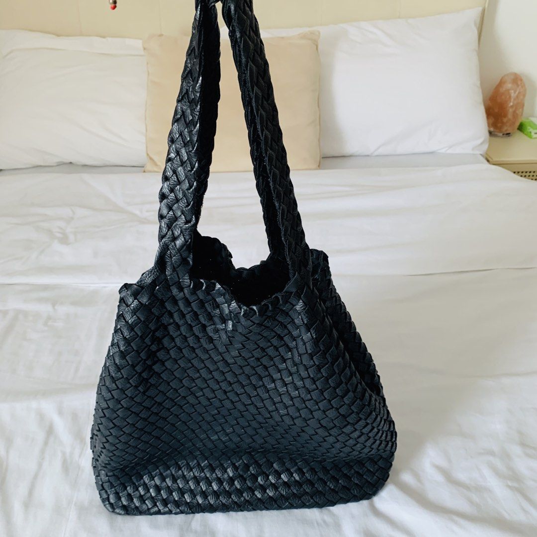 Black Woven Leather Shoulder Tote Bag (Category: Tote Bags) located in Makati City. Submitted by aliahs_personal_item (Listing ID 1470976663, Image 2). Description: - Color: Black - Material: Woven leather with solid leather flat bottom panel - Straps: Comfortable braided handles - Interior: Open, unlined, spacious compartment - Condition: Clean inside and out - Style: Everyday carryall tote.