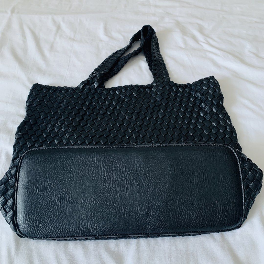 Black Woven Leather Shoulder Tote Bag (Category: Tote Bags) located in Makati City. Submitted by aliahs_personal_item (Listing ID 1470976663, Image 1). Description: - Color: Black - Material: Woven leather with solid leather flat bottom panel - Straps: Comfortable braided handles - Interior: Open, unlined, spacious compartment - Condition: Clean inside and out - Style: Everyday carryall tote.