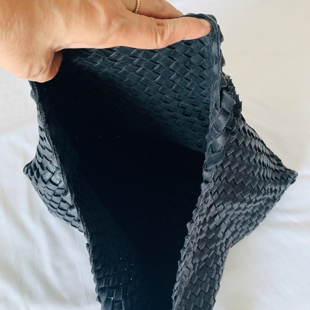 Black Woven Leather Shoulder Tote Bag (Category: Tote Bags) located in Makati City. Submitted by aliahs_personal_item (Listing ID 1470976663, Image 3). Description: - Color: Black - Material: Woven leather with solid leather flat bottom panel - Straps: Comfortable braided handles - Interior: Open, unlined, spacious compartment - Condition: Clean inside and out - Style: Everyday carryall tote.