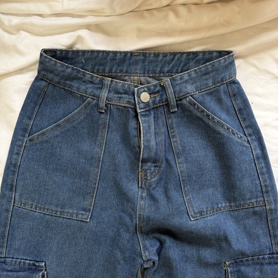 Blue Denim Cargo Jeans Wide Leg Pants (Category: Jeans) located in Cavite. Submitted by kydeclutter (Listing ID 1471002529, Image 2). Description: - Fit: High-waisted with a front button closure - Pockets: Large front utility pockets, side cargo pockets, and back patch pockets - Material: Durable, high-quality denim built for everyday wear - Pairing: Perfect to match with t-shirts and crop tops - Love the fabric! It’s think and high quality <3 - 