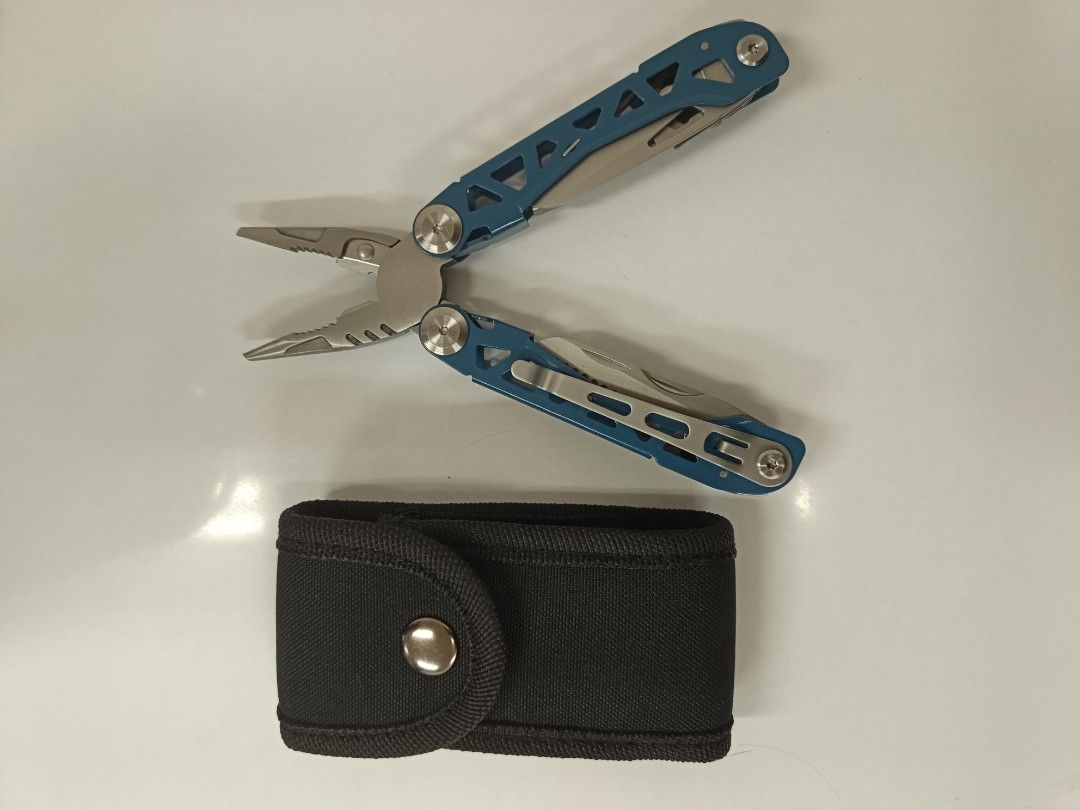 Blue Multi-Tool Pliers With Black Pouch (Category: Construction Tools & Equipment) located in Bacolod City. Submitted by viclawrence (Listing ID 1470999229, Image 2). Description: - Color: Blue with black fabric pouch - Material: Sturdy, heavy-duty stainless steel tools - Included tools: Pliers, knife, saw, bottle opener, files, screwdrivers, and hex wrench - Compact design: Folds up easily to fit in your pocket or the included sheath - Perfect f