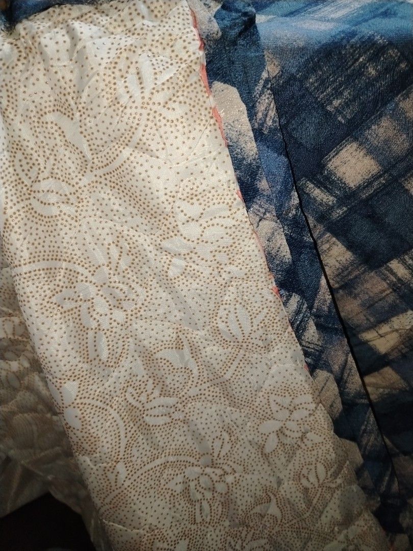 Blue Plaid Quilt with Floral Backing (Category: Bedding & Towels) located in Manila. Submitted by mimachelleukay (Listing ID 1471049870, Image 2). Description: - Blue and white plaid quilt - Reversible design with white background and gold floral pattern - Soft and cozy quilted texture - Perfect for layering on a bed or couch - Ideal winter blanket.