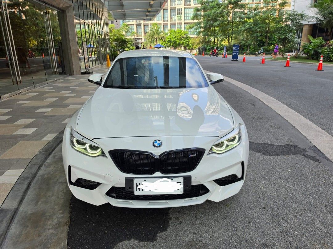 BMW M2 Competition Package (A) (Category: Used Cars) located in Pasig City. Submitted by nicoleenrico03 (Listing ID 1470998711, Image 1). Description: BMW M2 Competition 2019 14k km only Casa Maintained Flawless Interior Alpine White Exterior M Sport Seats Original M2 CS Frozen Gold Rims Complete papers & keys 3,800,000 Viewing in Rockwell.