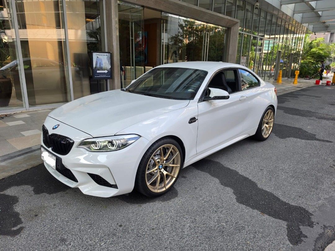 BMW M2 Competition Package (A) (Category: Used Cars) located in Pasig City. Submitted by nicoleenrico03 (Listing ID 1470998711, Image 2). Description: BMW M2 Competition 2019 14k km only Casa Maintained Flawless Interior Alpine White Exterior M Sport Seats Original M2 CS Frozen Gold Rims Complete papers & keys 3,800,000 Viewing in Rockwell.