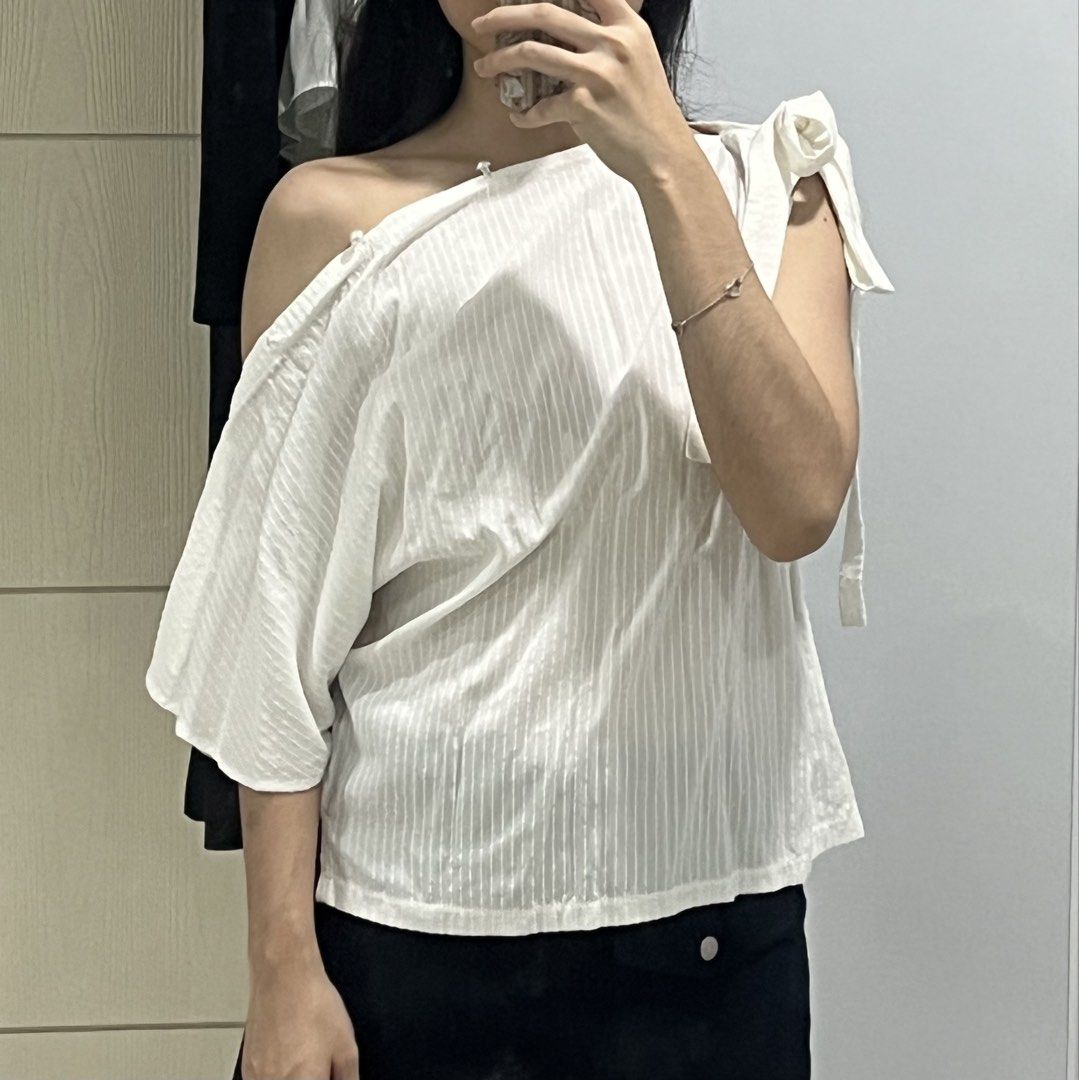 BNWT Indonesian Brand Multiway Blouse Top (Category: Blouses) located in Manila. Submitted by riri.to.you (Listing ID 1471048663, Image 3). Description: - brand new with tags - got this for approx. 900+ - buttons are all functioning, ribbon can be untied too - so many ways to wear! - fits xs to semi medium.