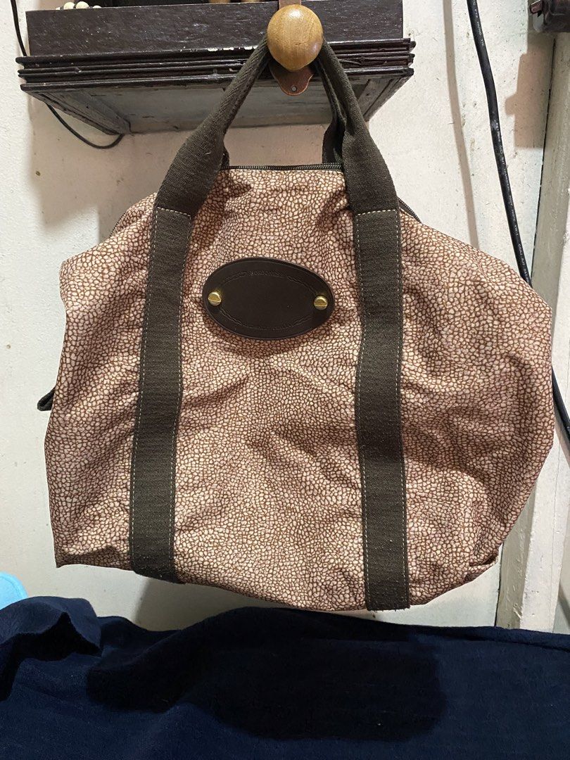 Borbonese Redwall Patented Vintage Handbag (Category: Luxury Bags & Wallets) located in Manila. Submitted by resi.diaz (Listing ID 1470958372, Image 1). Description: - Brand: Borbonese (Made in Italy) - Pattern: Iconic partridge eye - Color/Material: Brown canvas with matching trim and handles - Hardware: Gold-tone with engraved branding and patented zip stamp - Authenticity: Features Redwall serial number tag 935372 - Interior: Spacious compartm