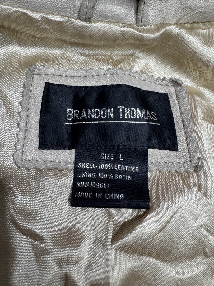 Brandon Thomas Metallic Leather Jacket Size L (Category: Coats, Jackets and Outerwear) located in Bustos. Submitted by thenlnclot60500 (Listing ID 1470934514, Image 2). Description: - Brand: Brandon Thomas - Material: 100% real leather shell with smooth satin lining - Color: Metallic champagne gold - Size: Large (fits true to size) - Features: Front zipper closure, structured collar, and two front pockets - Design: Clean construction with tailore