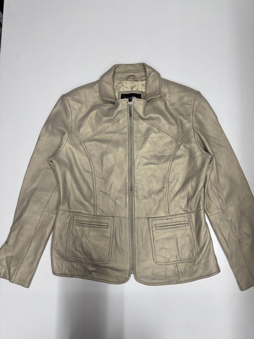 Brandon Thomas Metallic Leather Jacket Size L (Category: Coats, Jackets and Outerwear) located in Bustos. Submitted by thenlnclot60500 (Listing ID 1470934514, Image 1). Description: - Brand: Brandon Thomas - Material: 100% real leather shell with smooth satin lining - Color: Metallic champagne gold - Size: Large (fits true to size) - Features: Front zipper closure, structured collar, and two front pockets - Design: Clean construction with tailore