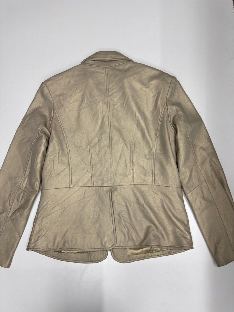 Brandon Thomas Metallic Leather Jacket Size L (Category: Coats, Jackets and Outerwear) located in Bustos. Submitted by thenlnclot60500 (Listing ID 1470934514, Image 3). Description: - Brand: Brandon Thomas - Material: 100% real leather shell with smooth satin lining - Color: Metallic champagne gold - Size: Large (fits true to size) - Features: Front zipper closure, structured collar, and two front pockets - Design: Clean construction with tailore