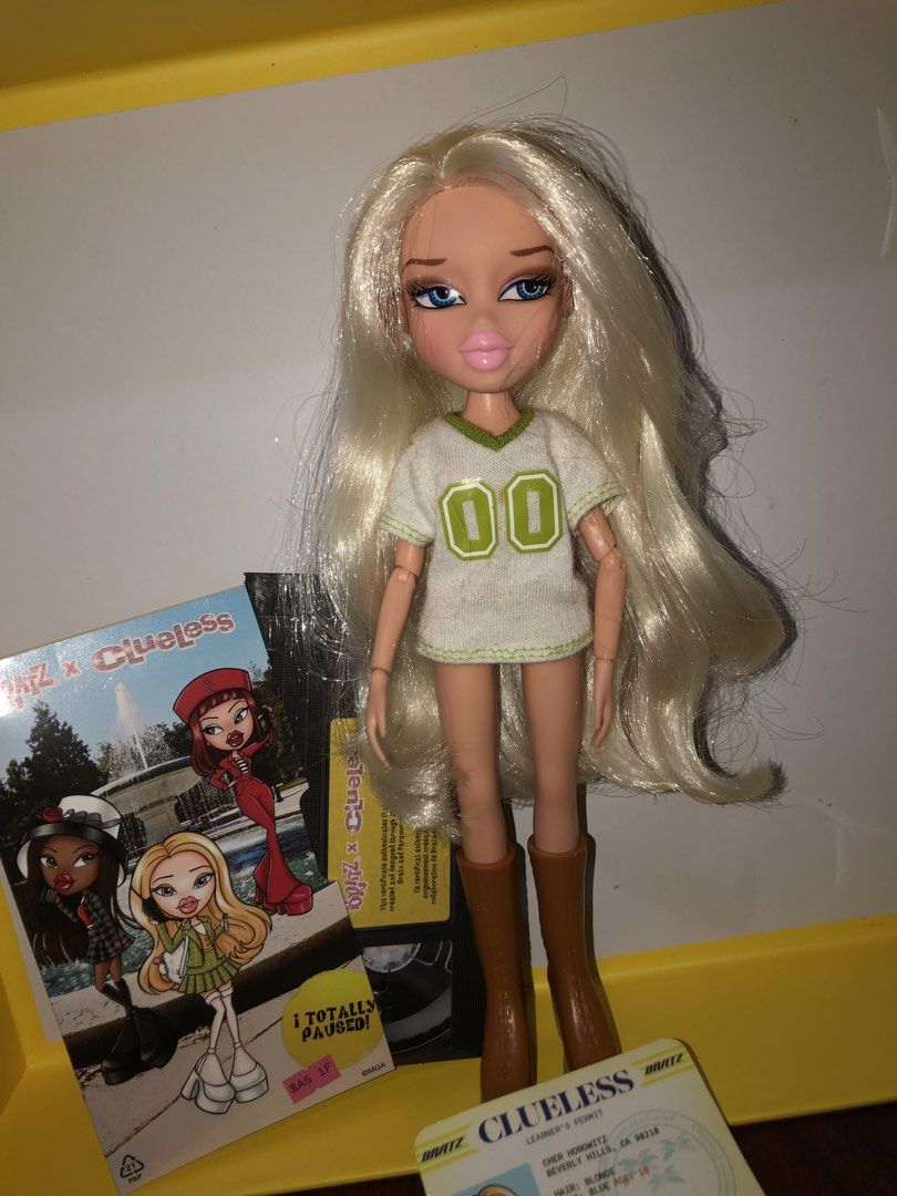 Bratz x Clueless Cher Horowitz Doll with box (Category: Kids Toys) located in Angeles City. Submitted by bratzdylan (Listing ID 1470943028, Image 1). Description: - Bratz x Clueless Cher Horowitz collector doll - Excellent overall condition with all original accessories included - Features iconic white and green jersey top, brown boots, long blonde hair, and blue eyes - Includes mini poster, collector ID card, and original packaging box - A must-