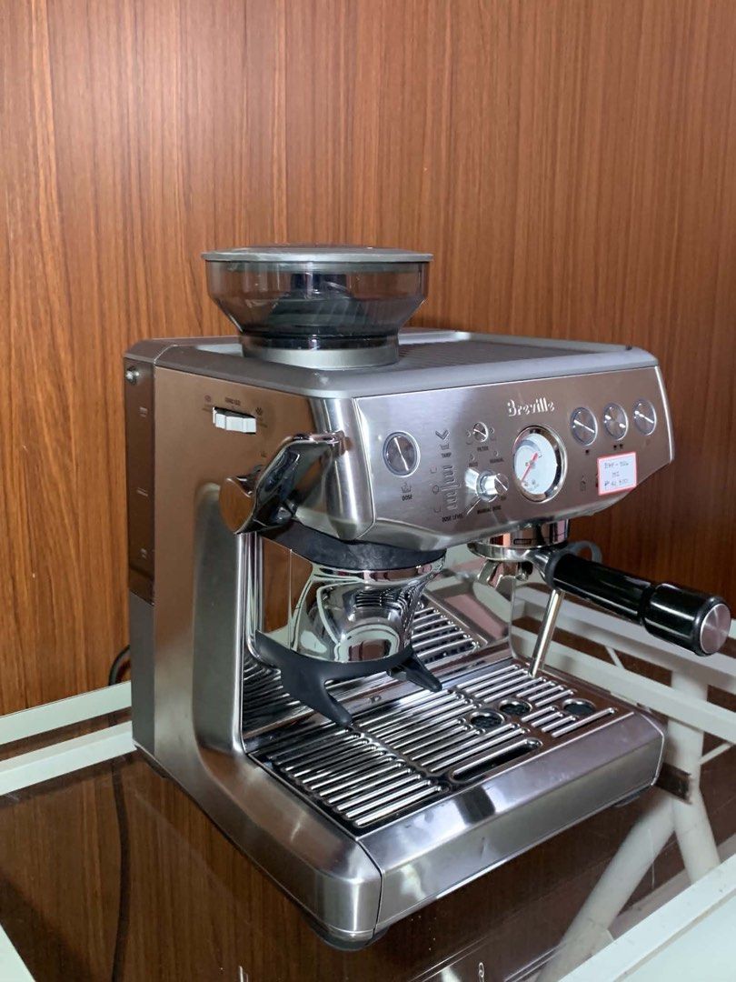 Breville Barista Express Espresso Machine (Category: Coffee Machines & Makers) located in Pulilan. Submitted by sebbii (Listing ID 1470959218, Image 3). Description: Breville espresso machine in stainless steel finish. Built-in grinder on top with bean hopper. Pressure gauge right on the front panel. Portafilter locks into the group head smoothly. Steam wand attached on the side for frothing milk. Drip tray sits securely underneath. Power button,