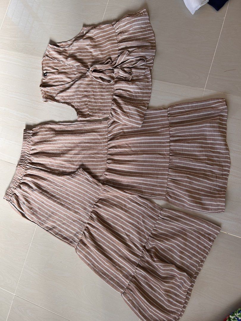 Brown Coords Pants Set- XL (Category: Sets or Coordinates) located in Caloocan City. Submitted by declutterieee (Listing ID 1471028162, Image 3). Description: - Color/Pattern: Brown and white vertical stripes - Set includes: Sleeveless top and matching pants - Top details: Double front ties and a cute ruffled hem - Pants details: Comfy elastic waistband and stylish tiered ruffled legs - Fabric: Lightweight and breathable material - Condition: Bra